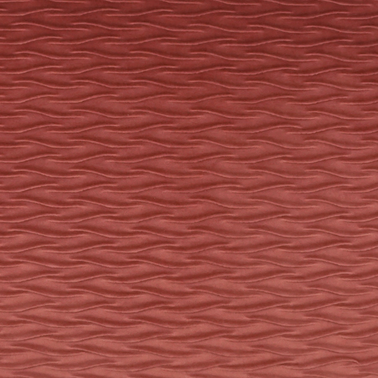 Terracotta red fabric with subtle wavy embossed texture.