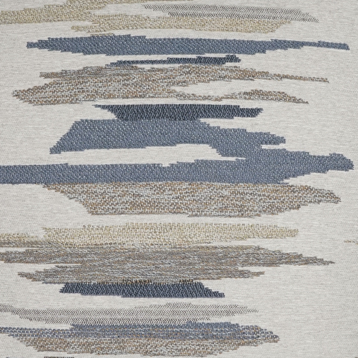 Abstract woven rug with blue, beige and taupe brushstroke stripes on a light background.