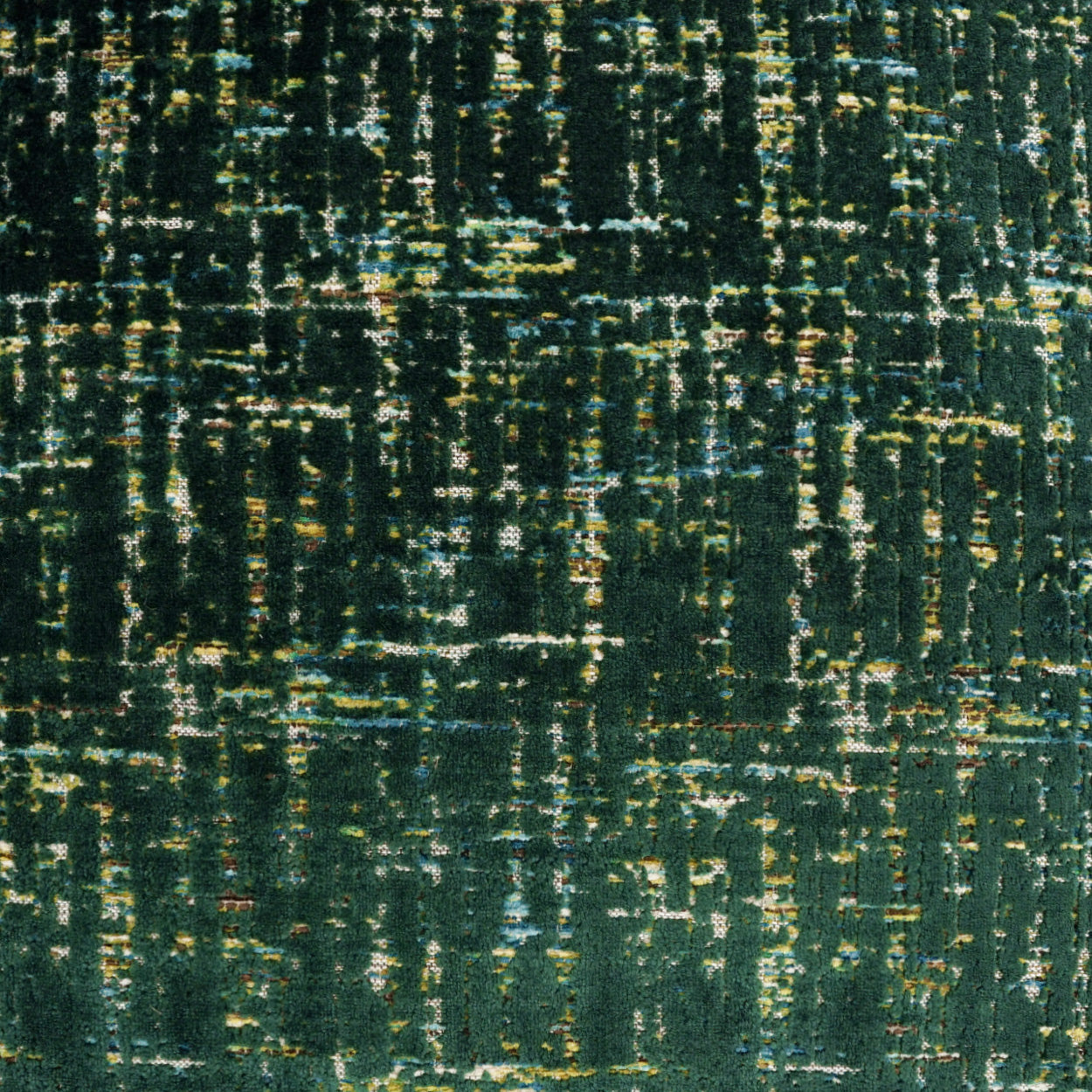 Close-up of teal-green woven fabric with irregular yellow, blue and white streaks.