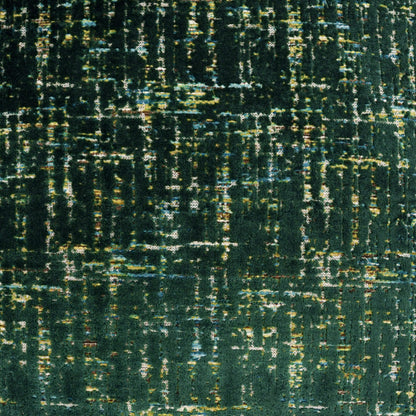 Close-up of teal-green woven fabric with irregular yellow, blue and white streaks.
