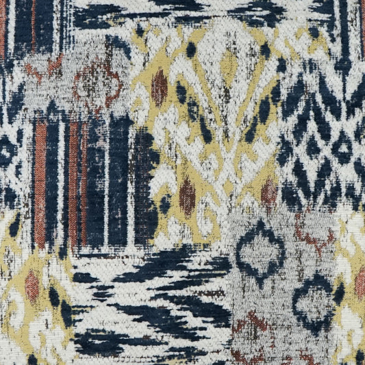 Woven textile with ikat-inspired geometric motif in navy, ivory, mustard yellow and rust; rug or upholstery fabric.