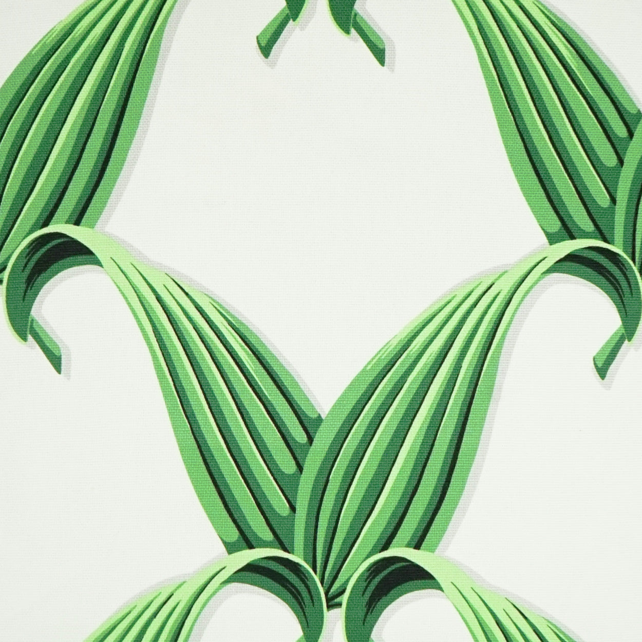 Bright green ribbon-striped fabric with curved overlapping bands forming a bold geometric pattern.