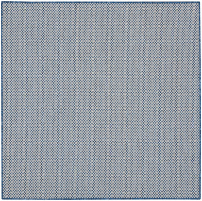 Blue and off-white diamond lattice rug with navy border.