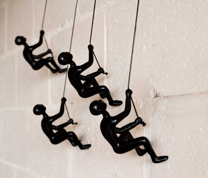Set of Four Black Resin Climbing Man Hanging Dimensional Sculpture