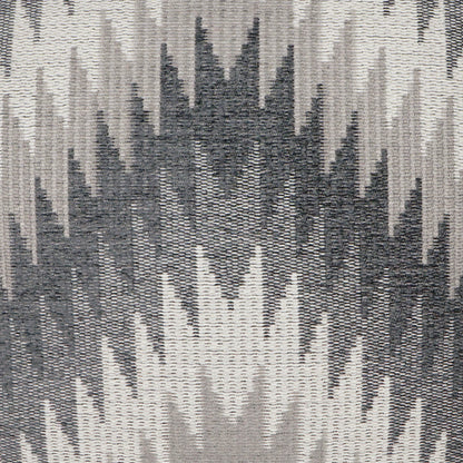 Pillow with textured woven fabric and an abstract grayscale ikat/chevron pattern in charcoal, gray and beige (24" x 24").