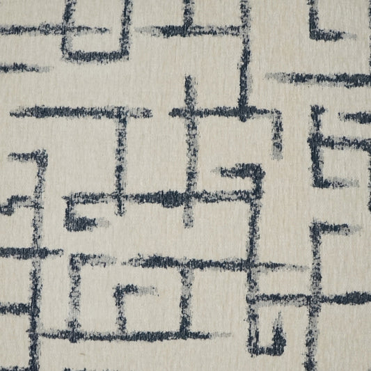 Cream fabric with navy blue geometric maze lines; a woven textile for upholstery & drapery.