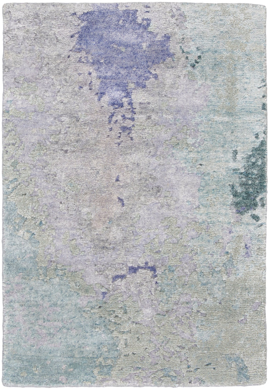 Pastel abstract area rug with lavender, blue and mint tones in watercolor-like pattern and soft texture.