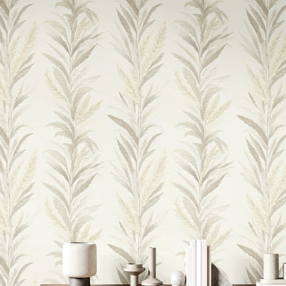 Beige wallpaper featuring a leaf motif with rose and gold embossed detailing.