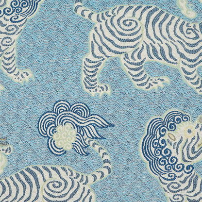 Blue pillow with cream and navy zebra motifs and swirling cloud patterns; 24" x 24