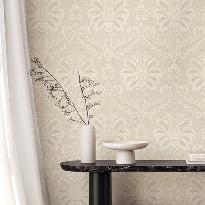 Beige traditional damask wallpaper with a textured finish.