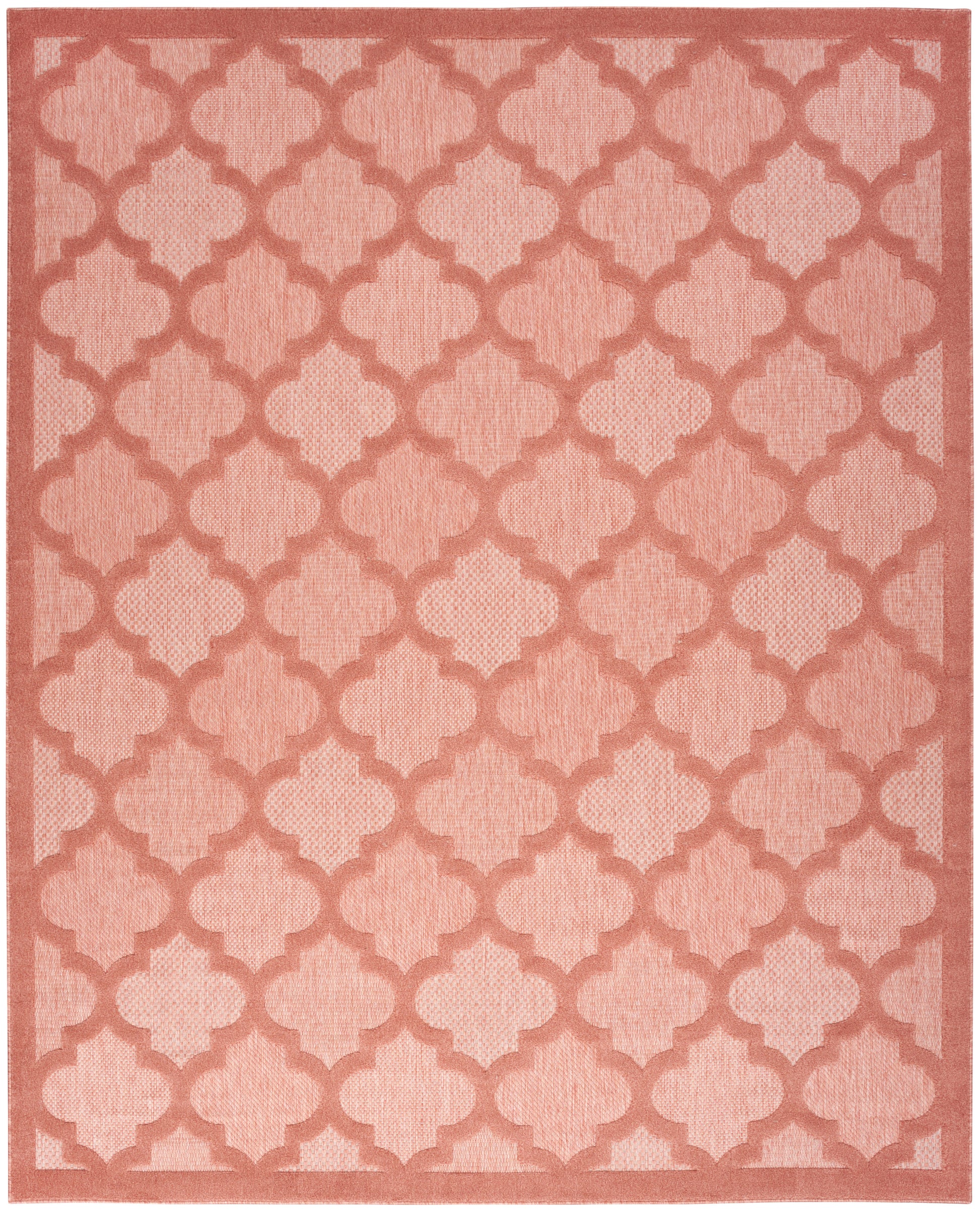 Salmon-pink area rug with lighter pink trellis quatrefoil lattice and border, soft woven texture.