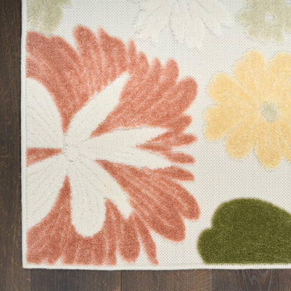 Cream floral area rug with a bold coral flower, pale yellow blossoms and olive green leaves; soft plush pile.