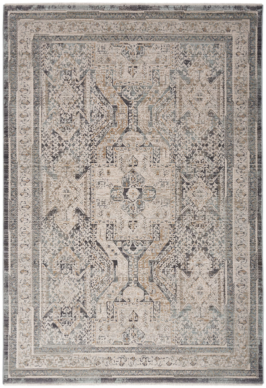 Rectangular distressed vintage rug with geometric central medallion, ivory, beige, gray and blue tones, ornate border.