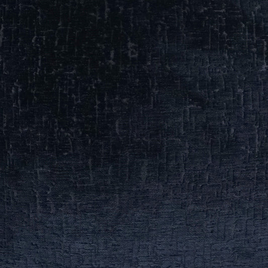Close-up of dark navy velvet-like fabric with soft nap and subtle sheen.