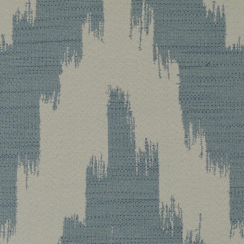 Blue-gray and cream woven drapery fabric with a bold jagged ikat pattern.
