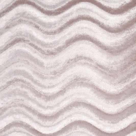 Soft pale pink plush fabric with ridged, wavy pattern; fur-like texture for throws or upholstery.