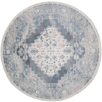 Round blue distressed oriental rug with a central diamond medallion and faded floral motifs.