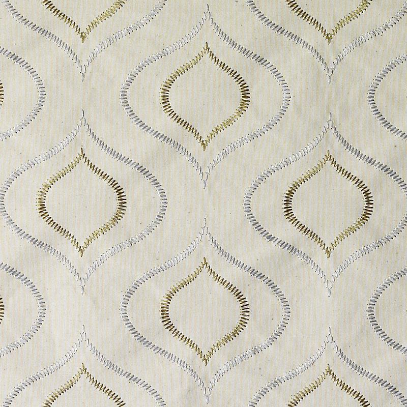 Cream-beige fabric with metallic gold and silver embroidery forming repeated teardrop/diamond motifs.