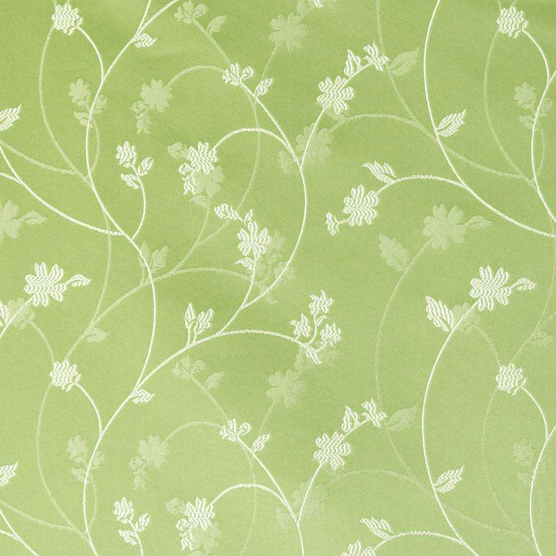 Lime green upholstery fabric featuring white botanical vines and delicate flowers in a decorative repeating pattern.