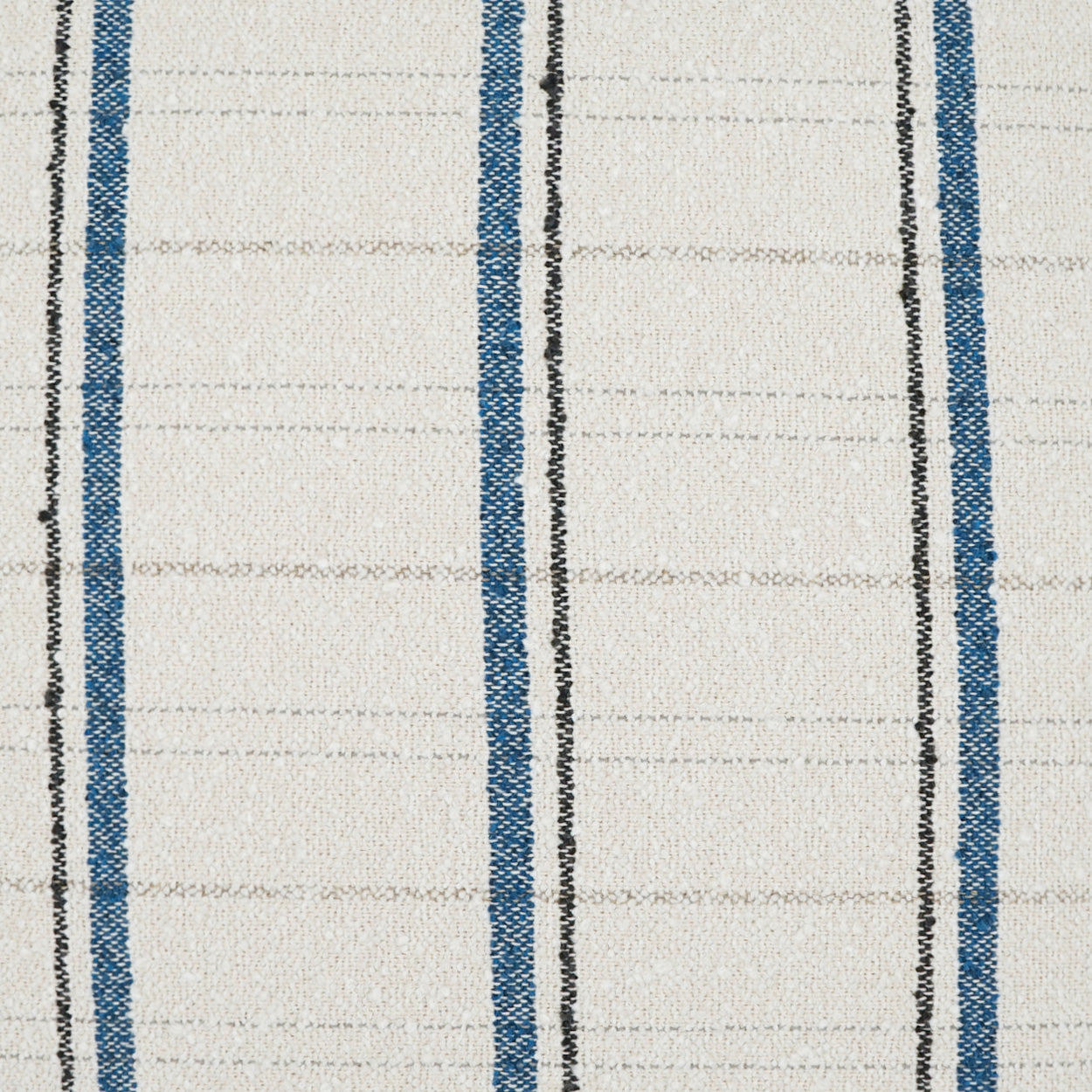 Beige woven fabric with bold blue vertical stripes and thin black lines; classic upholstery or curtain fabric.