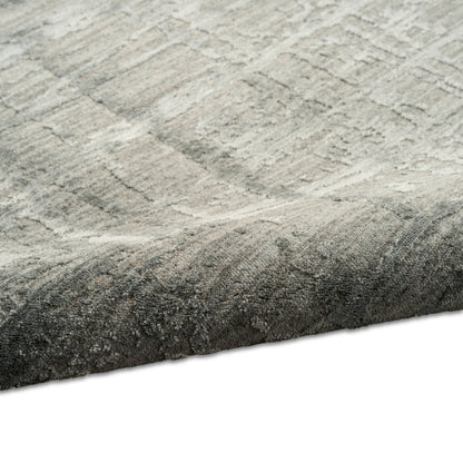 Soft gray textured area rug with a subtle geometric pattern and plush pile; thick, cozy floor accent.