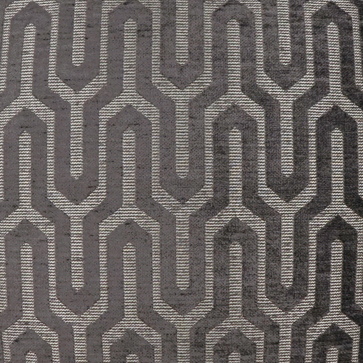 Pillow in gray woven fabric with a light beige interlocking chain-link geometric pattern; upholstery-grade texture.