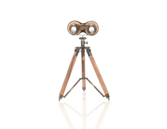 Vintage brass binoculars on a wooden tripod stand, antique-style desk display.