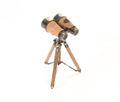 Antique wooden binoculars with brass fittings on a compact wooden tripod.
