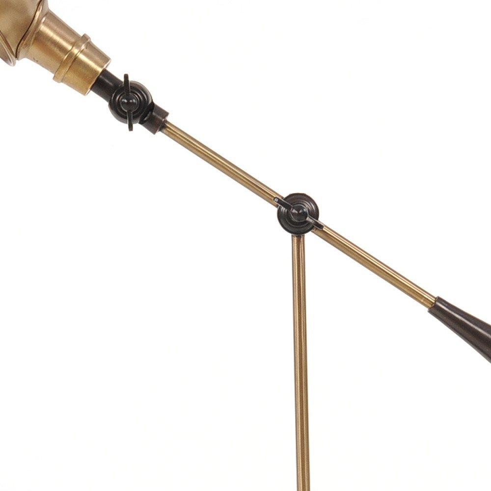 Brass-tone two-segment lamp arm with black hinge joints for adjustable desk lighting.