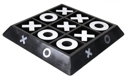 Nickel and dark wood tic-tac-toe game sculpture with a 3x3 grid and white X and O markers; angled view with decorative side X/O marks.