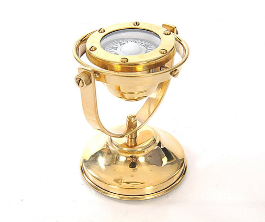 4.5" x 5" x 5.5" gold-tone brass gimbaled compass.