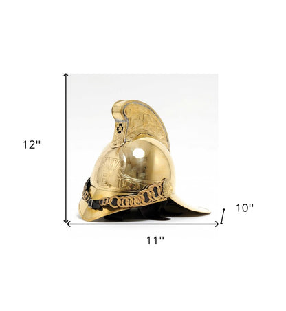 Gold-tone decorative firefighter helmet with ornate crest and chain, 12 inches tall and 11 inches wide