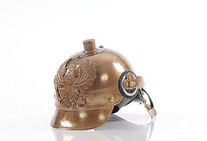 Brass-toned steampunk helmet with embossed eagle crest, domed crown, curved brim, and gear badge on the side.