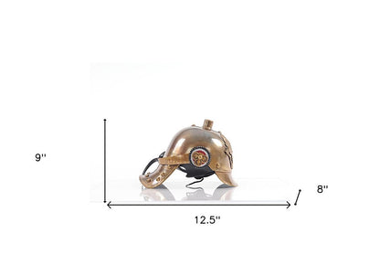 Brass-toned steampunk helmet with rivets, gear emblem and chin strap; decorative cosplay/display piece.