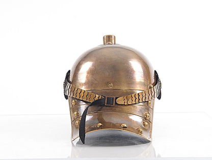 Bronze gladiator helmet with braided leather strap, black buckle, and riveted cheek and neck guard.