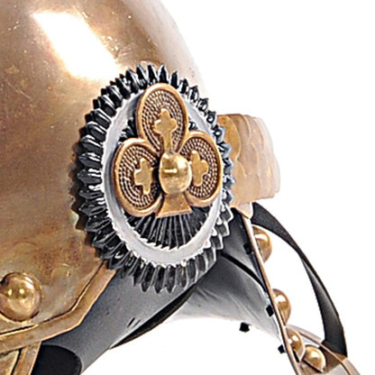 Bronze steampunk helmet close-up with circular gold emblem, gear-textured black rim and leather strap.