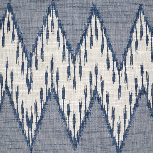 Blue-gray fabric with bold white zigzag ikat diamond pattern.