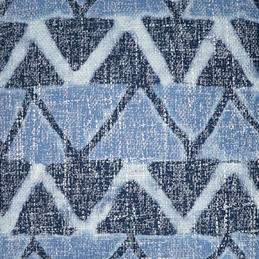 Blue geometric zigzag knit fabric with light/dark blue triangles and speckled texture.