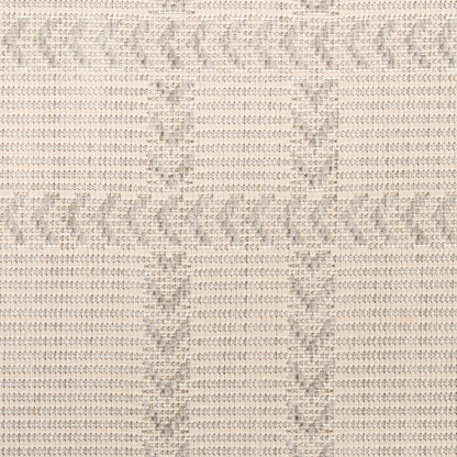 Beige knit fabric with subtle chevron zigzag pattern; soft, textured textile swatch.