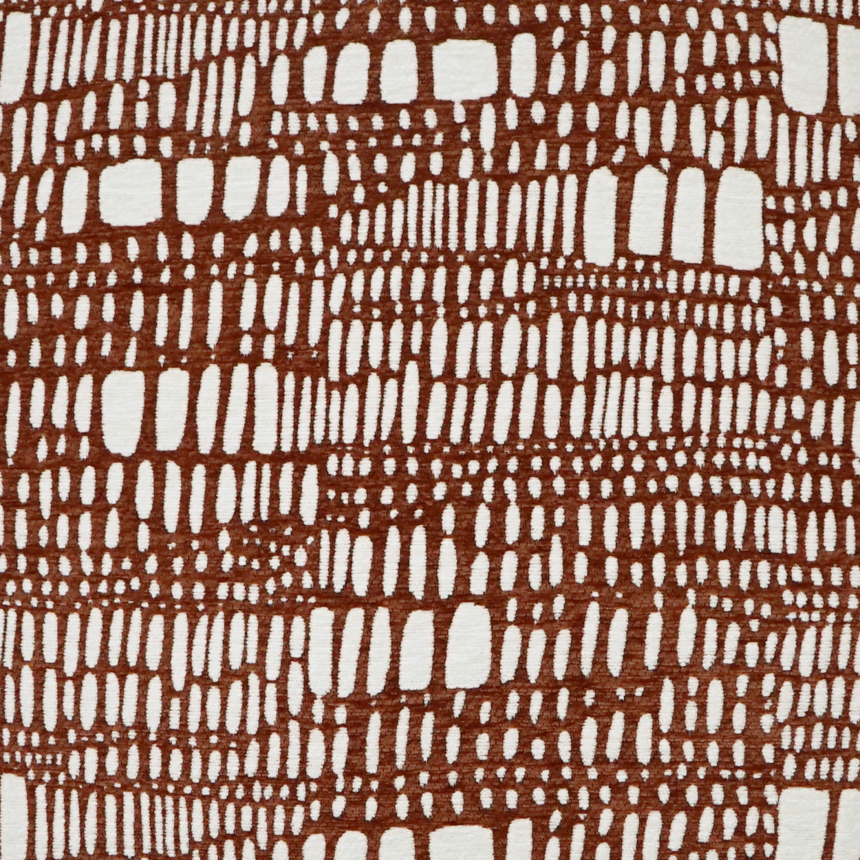 Brown faux crocodile-pattern fabric with white gaps; textured textile suitable for upholstery or fashion.