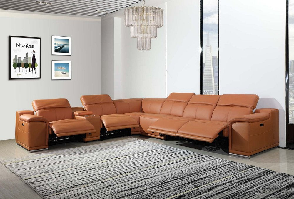 Orange leather sectional sofa with reclining seats in a modern living room; gray striped rug and large windows.