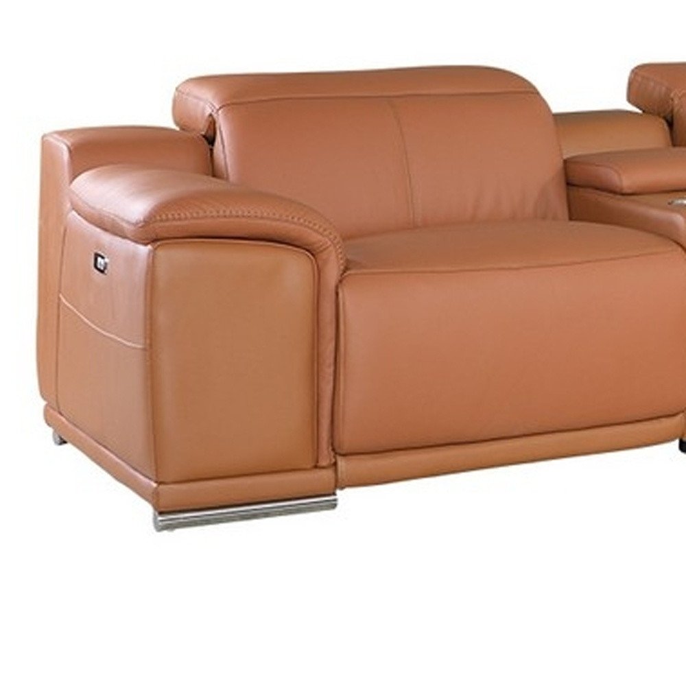 Tan leather sofa with rounded padded arms, contemporary style, cushioned seat and back, chrome rail base.