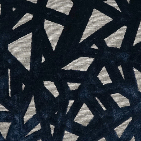 Dark navy geometric lattice pattern on beige fabric with bold angular shapes for upholstery or drapery.