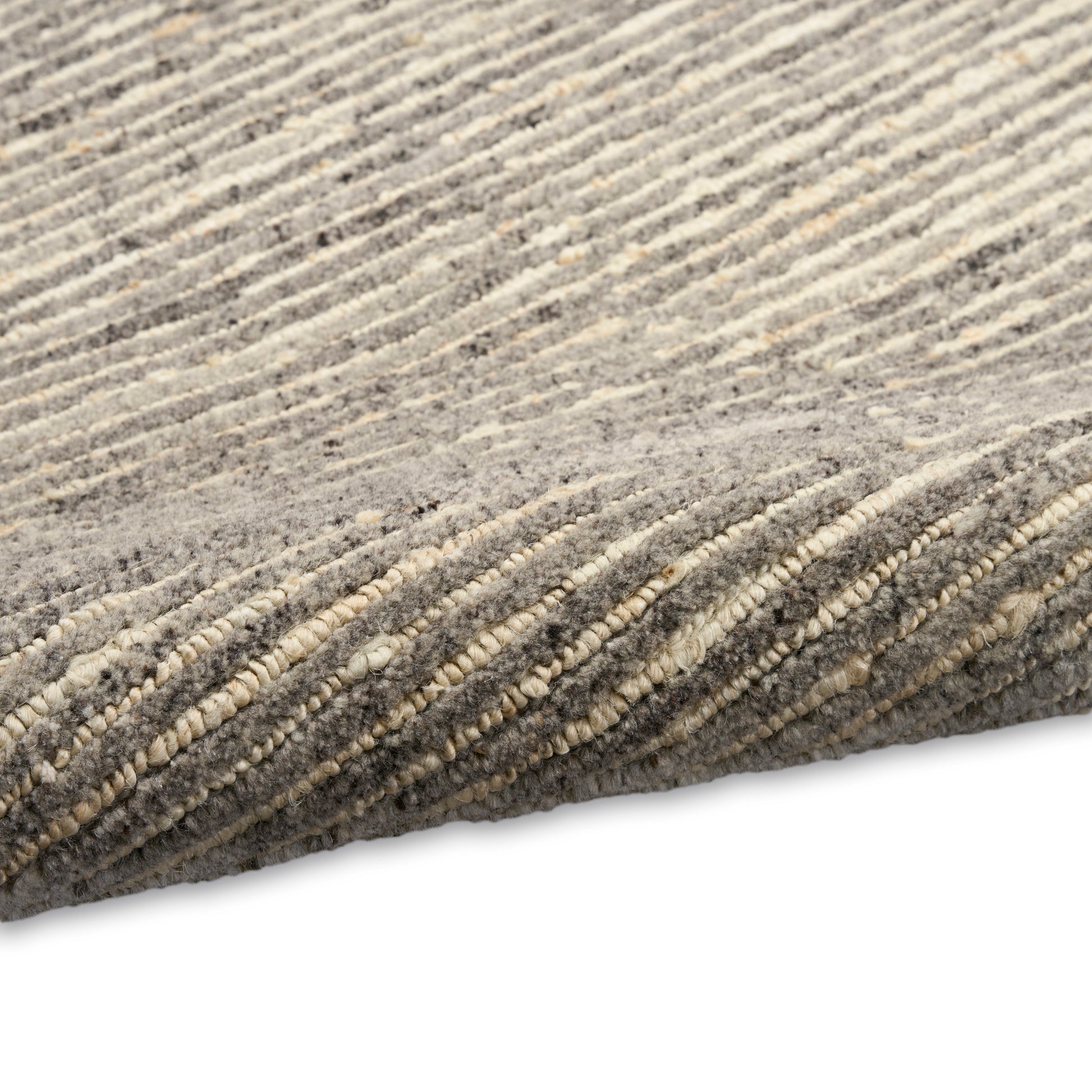 Gray and beige striped plush area rug with soft, textured pile.