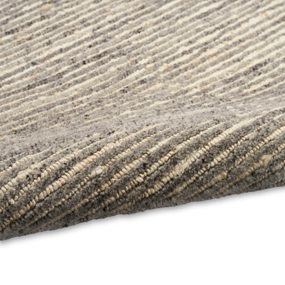 Gray and beige striped plush area rug with soft, textured pile.