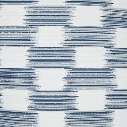 Blue brushstroke striped squares on white fabric pillow; modern geometric design for decor.