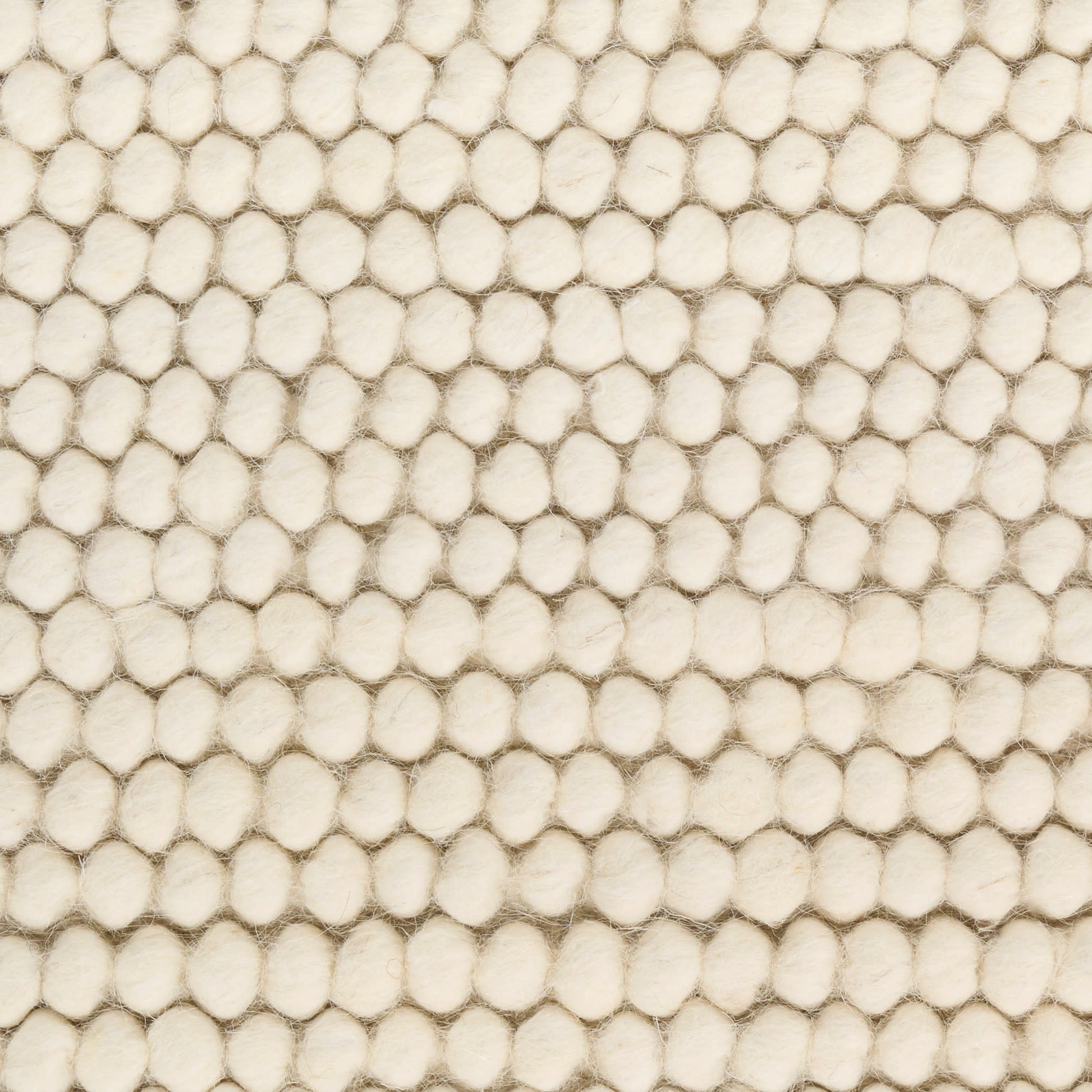 Cream boucle fabric with dense raised circular bobbles for a soft, textured surface.