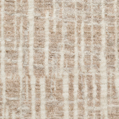 Beige shag rug with cream vertical stripes; soft, textured pile for modern living spaces.