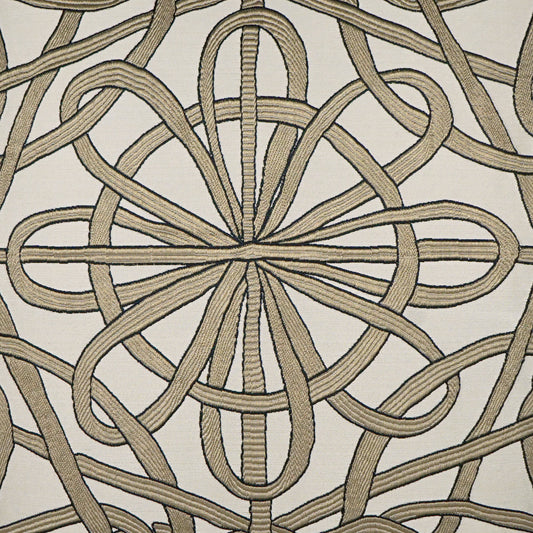 Beige braided rope knot motif forming a circular mandala on off-white fabric; decorative upholstery textile.