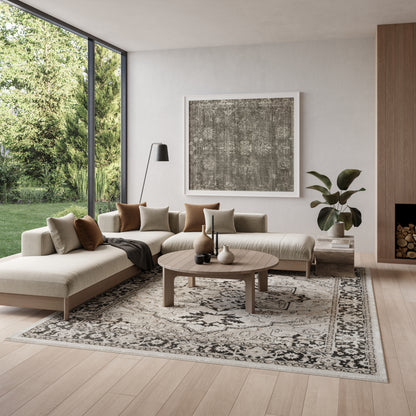Vintage beige patterned rug, 8' x 10', shown in a living room with a neutral sofa, round wooden coffee table and abstract art.
